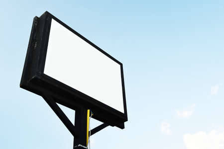 Blank white billboard on blue background.