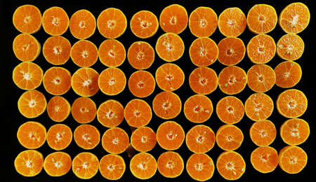 Orange fruit with cut in half for background