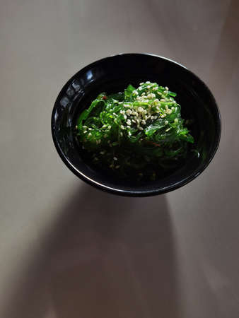 close up of japanese seaweed salad served on tableの写真素材
