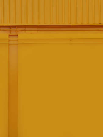 Concrete wall yellow color for texture backgroundの写真素材