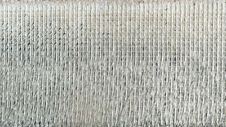 close up of silver foil with shiny surface for backgroundの写真素材
