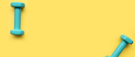 close up of dumbbell on yellow backgroundの写真素材