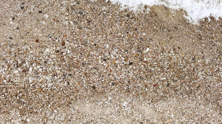 Wave of the sea on the sand beachの写真素材