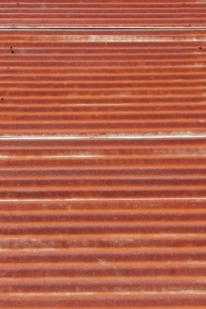 Old zinc surface background or the tin roof background with the rustの写真素材