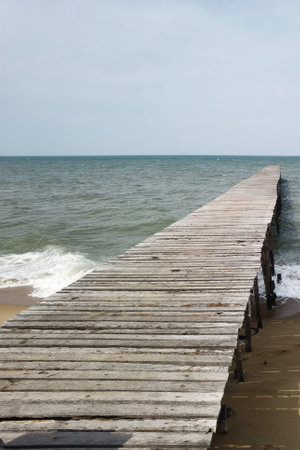 Wooden bridge on the tropical beach and blue sky summer backgroundの写真素材