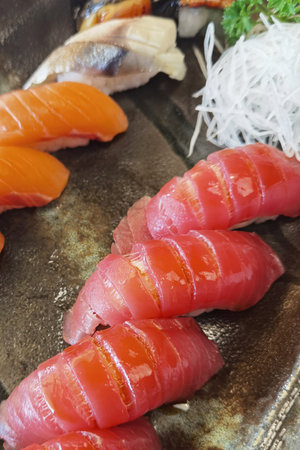 Closeup of fresh sushi on ceramic dish, Japanese foodの写真素材