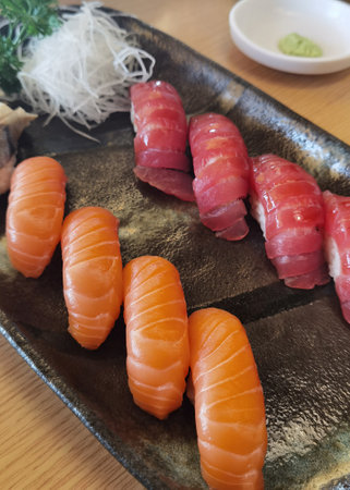 Closeup of fresh sushi on ceramic dish, Japanese foodの写真素材