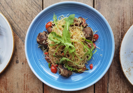 Top view of spaghetti pasta with meat on plateの写真素材