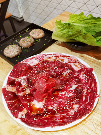 Fresh cut Wagyu beef slices served on a plateの写真素材