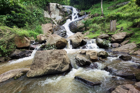 Beautiful of river stream waterfall in forest landscapeの写真素材