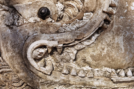 Dragon carving art on the wall, Thailand.の写真素材