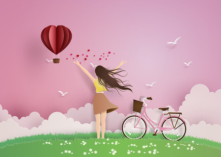 Illustration of love and valentine day,Beautiful girl stretches her arms on the sky with paper heart hot air balloon.paper art and craft style.のイラスト素材