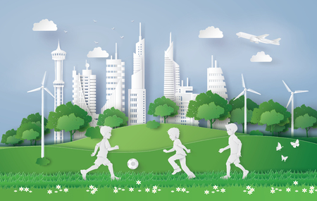 eco concept with boy plaing football in the city park , Paper art and digital craft style.のイラスト素材