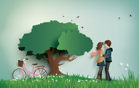 Illustration of love and valentine's Day,  with couple standing hugging on a grass field with pink bicycle and big tree.paper art  style.のイラスト素材