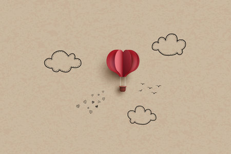 Origami made colorful hot air balloon fly over grass. Hand drawing and paper cut.の写真素材