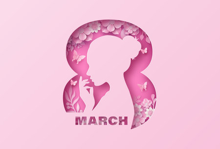 A pink paper cut design featuring a woman's silhouette inside the number 8, symbolizing International Women's Day on March 8の写真素材