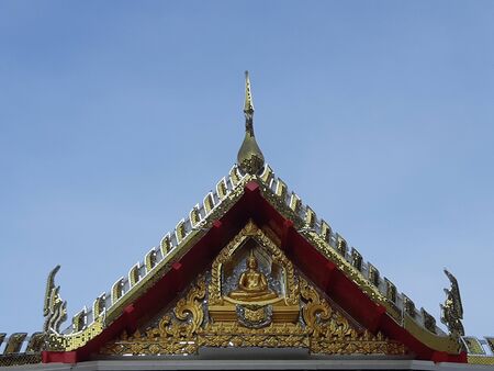 Thai temple art roof with a blue sky background