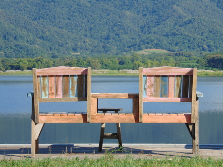 Wooden chairs are set in the middle of nature.の写真素材