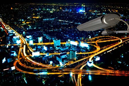 cctv security system  to highway night scene from  from skyscraper rooftop