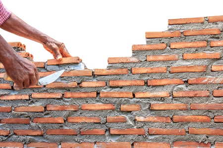 bricklayer  building wall concrete isolated on white background 