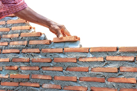 bricklayer  building wall isolated on white