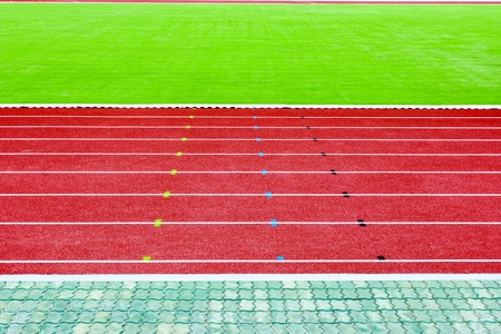 running track and green grass