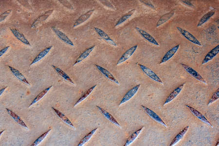 a sheet of rusty old diamond plate metalの写真素材