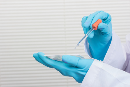 Portrait of a confident female professional in his working in chemical laboratory