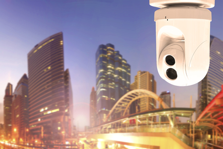 Security Camera or surveillance Operating on urban scene in sunsetの写真素材