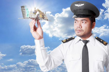 Pilot looking at model airplane concept travel around the world の写真素材