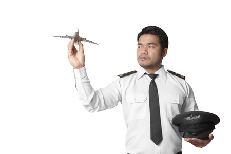 Pilot with model airplane isolated on white background with clipping path