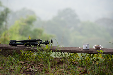 relaxation corner with coffee bread, green forest backgroundの写真素材