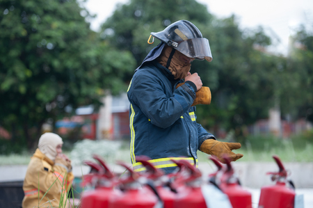 A firefighters dress their suit before the operatingのeditorial素材
