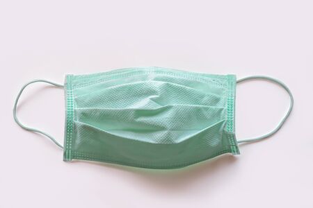 green color medical masks in isolated with white background, clipping pathの写真素材