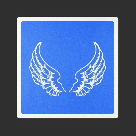 Angel wings traffic sign recycled paper on white background.の写真素材