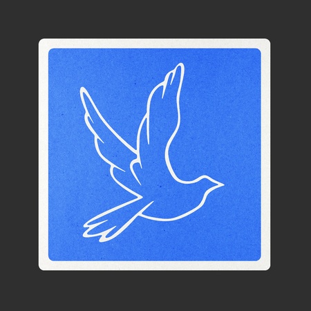 Bird traffic sign recycled paper on white background.の写真素材