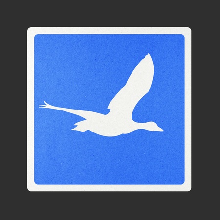 Bird traffic sign recycled paper on white background.の写真素材