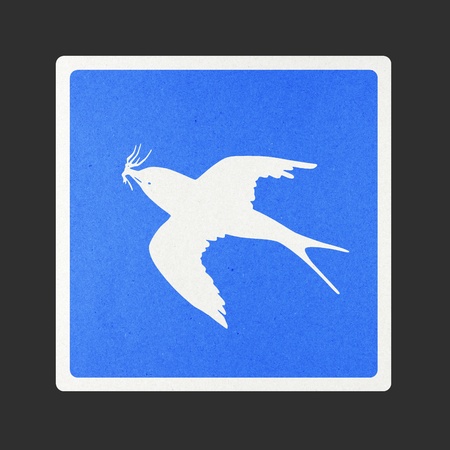 Bird traffic sign recycled paper on white background.の写真素材