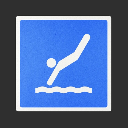 Diving traffic sign recycled paper on white background.の写真素材
