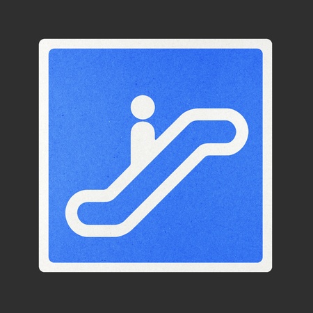 Escalator traffic sign recycled paper on white background.の写真素材