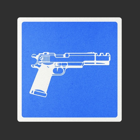 Gun traffic sign recycled paper on white background.の写真素材