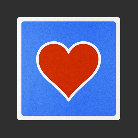 Heart traffic sign recycled paper on white background.