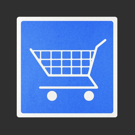 Shopping cart traffic sign recycled paper on white background.の写真素材