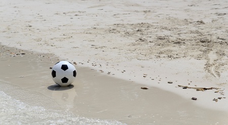 Soccer ball on beach.の写真素材