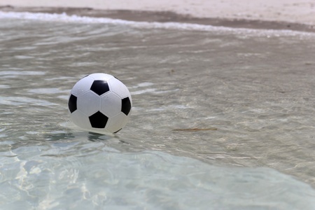 Soccer ball on sea water.の写真素材