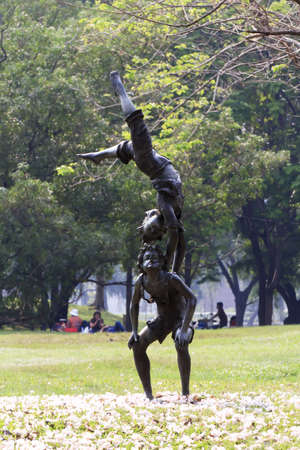 Statue of acrobatics at park in bangkok, thailandの写真素材