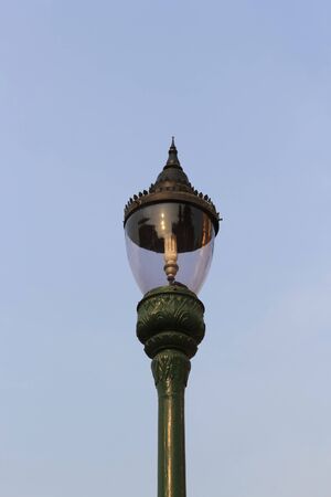 Thai street lamp on blue sky backgroundの写真素材