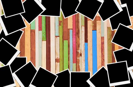 Blank instant photo frames on wooden background. の写真素材