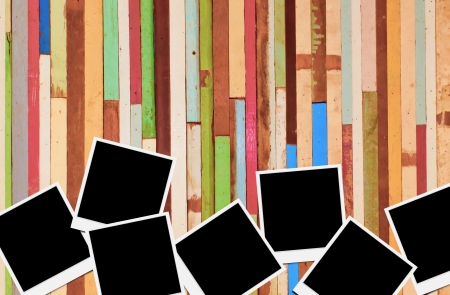 Blank instant photo frames on wooden background. の写真素材