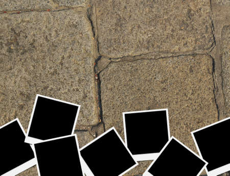Blank instant photo frames on old brick floor and small cracks  